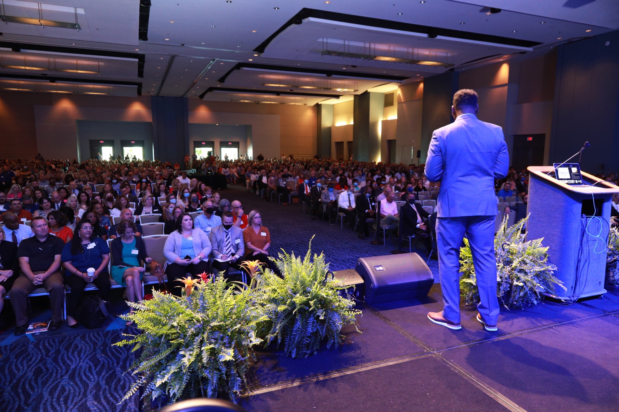 Freddie Scott II speaking to a packed room